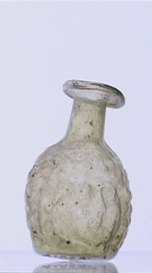 84. Balsamario bifronte, dalla regione siro-palestinese (II sec. d.C.). Museu d'Arqueologia de Catalunya, Barcelona.